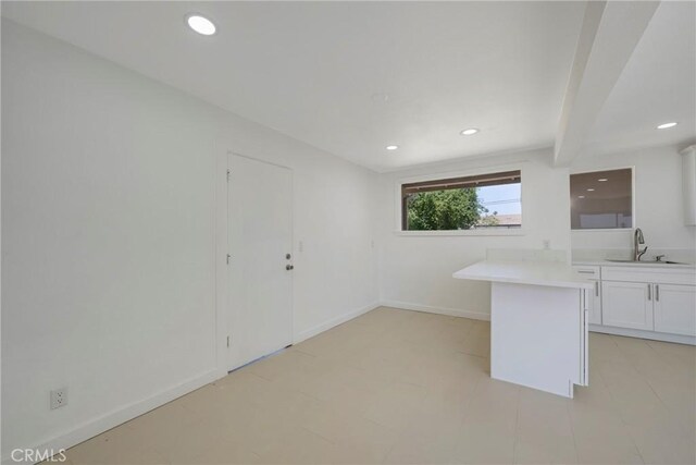 8888 Patrero St, Riverside, CA 92503 - kitchen featuring light countertops, white cabinets, and recessed lighting