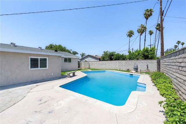 8888 Patrero St, Riverside, CA 92503 - view of swimming pool featuring a fenced backyard and a patio