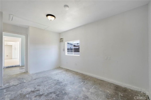 8888 Patrero St, Riverside, CA 92503 - spare room featuring attic access, an AC wall unit, and a smoke detector