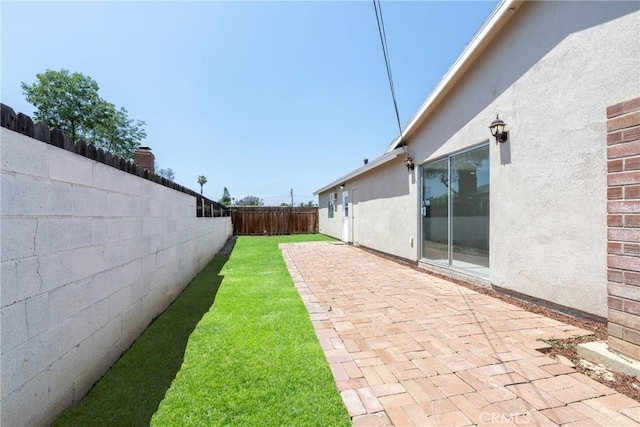 8888 Patrero St, Riverside, CA 92503 - fenced backyard with a patio