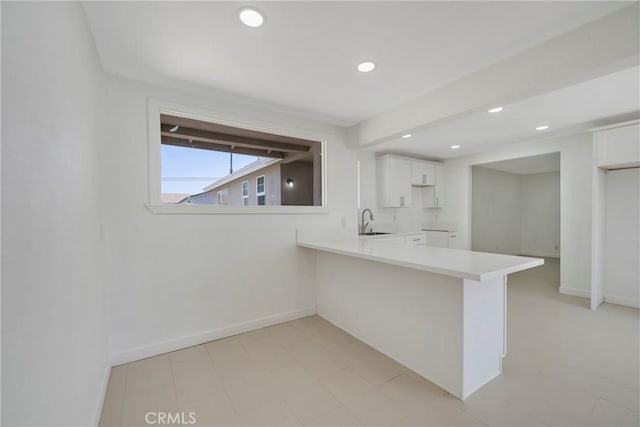 8888 Patrero St, Riverside, CA 92503 - kitchen featuring recessed lighting, white cabinetry, light countertops, and a peninsula