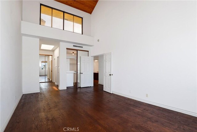 435 S La Fayette Park Pl Unit 311, Los Angeles, CA 90057 - unfurnished living room featuring dark wood-style floors and high vaulted ceiling