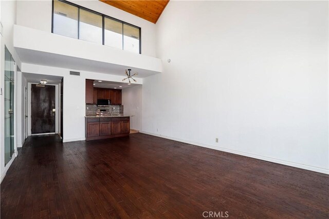 435 S La Fayette Park Pl Unit 311, Los Angeles, CA 90057 - unfurnished living room with high vaulted ceiling and dark wood-style floors