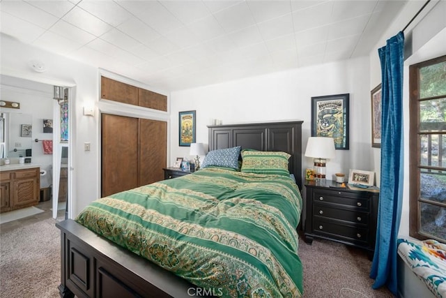 1799 Saint Thomas Ave, Cambria, CA 93428 - bedroom with dark colored carpet, a closet, and ensuite bathroom