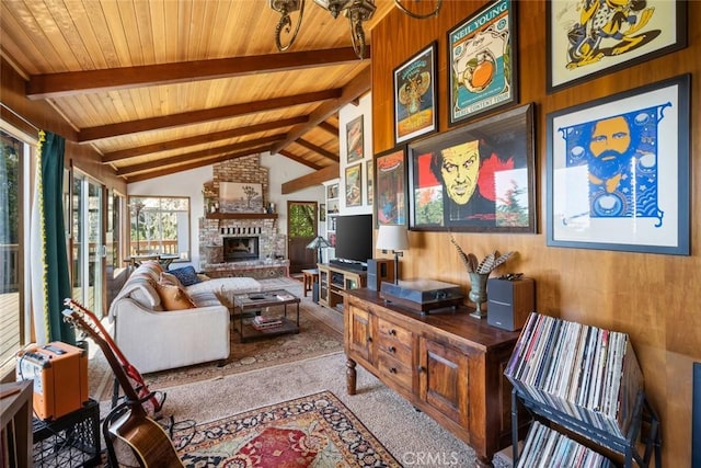 1799 Saint Thomas Ave, Cambria, CA 93428 - carpeted living room featuring healthy amount of natural light, wood ceiling, a fireplace, and wood walls
