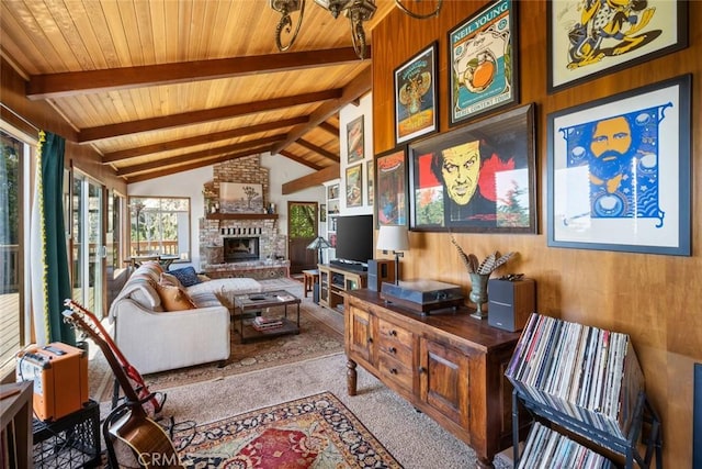 1799 Saint Thomas Ave, Cambria, CA 93428 - carpeted living area featuring plenty of natural light, wood ceiling, a fireplace, and wooden walls