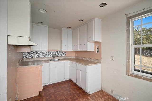 1799 Saint Thomas Ave, Cambria, CA 93428 - kitchen with white cabinets, backsplash, and light countertops