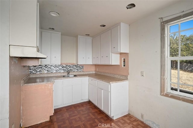 1799 Saint Thomas Ave, Cambria, CA 93428 - kitchen featuring tasteful backsplash, white cabinets, and light countertops