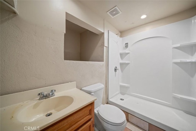1799 Saint Thomas Ave, Cambria, CA 93428 - bathroom with vanity, a shower, and a textured wall