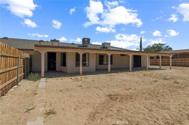 27363 Azurite Rd, Barstow, CA 92311 - rear view of house featuring a patio, a fenced backyard, and stucco siding