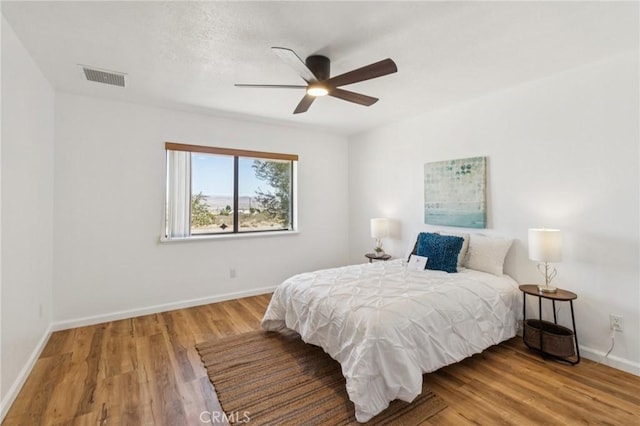 27363 Azurite Rd, Barstow, CA 92311 - bedroom with wood finished floors and a ceiling fan