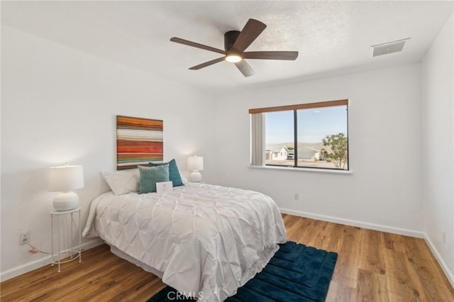 27363 Azurite Rd, Barstow, CA 92311 - bedroom with wood finished floors and a ceiling fan