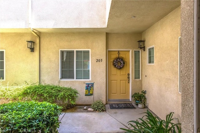 93 Kansas St Unit 205, Redlands, CA 92373 - view of exterior entry featuring stucco siding
