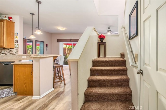 93 Kansas St Unit 205, Redlands, CA 92373 - staircase with wood finished floors and ceiling fan