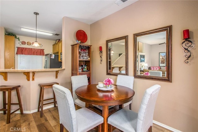 93 Kansas St Unit 205, Redlands, CA 92373 - dining area with wood finished floors and baseboards