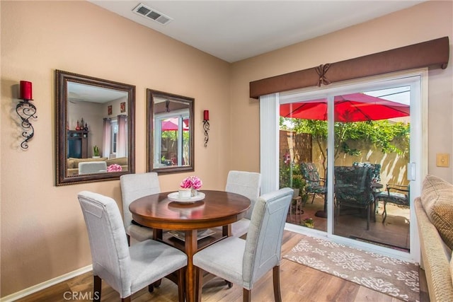 93 Kansas St Unit 205, Redlands, CA 92373 - dining area with wood finished floors and baseboards
