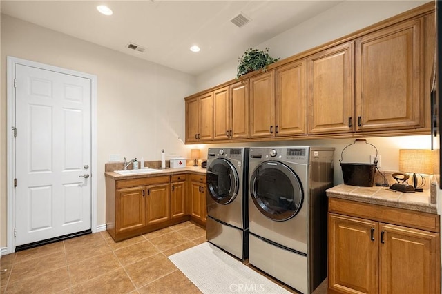33260 Susan Grace Ct, Temecula, CA 92592 - washroom featuring washer and dryer, cabinet space, recessed lighting, and light tile patterned floors
