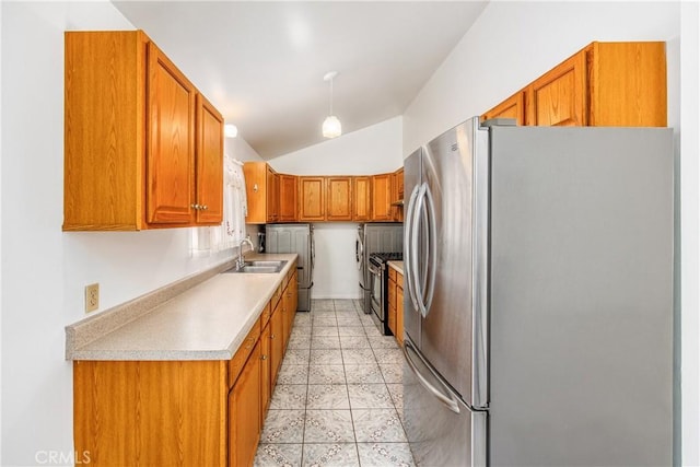 9780 Almeria Ave, Fontana, CA 92335 - kitchen with appliances with stainless steel finishes, vaulted ceiling, brown cabinets, light countertops, and light tile patterned floors