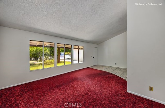 9780 Almeria Ave, Fontana, CA 92335 - spare room featuring a textured ceiling, carpet flooring, and lofted ceiling