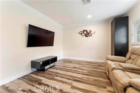 7922 Ducor Ave, West Hills, CA 91304 - living area with wood finished floors, crown molding, and recessed lighting