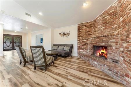 7922 Ducor Ave, West Hills, CA 91304 - living area featuring wood finished floors, a fireplace, and recessed lighting