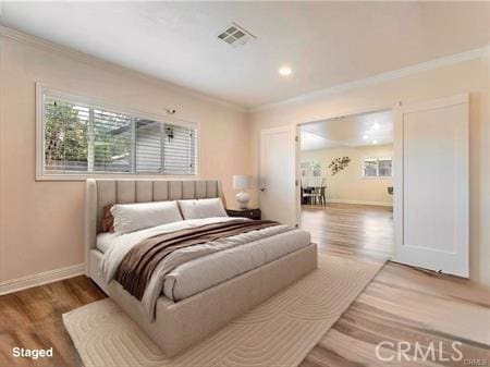7922 Ducor Ave, West Hills, CA 91304 - bedroom with crown molding, wood finished floors, and recessed lighting