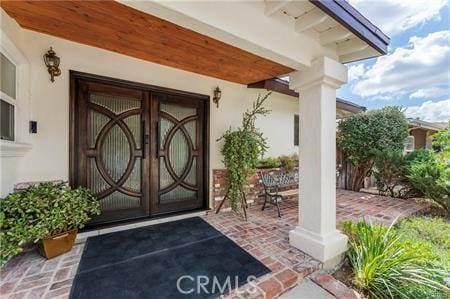 7922 Ducor Ave, West Hills, CA 91304 - property entrance with stucco siding and french doors