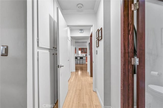 1203 N Sweetzer Ave Unit 215, West Hollywood, CA 90069 - hall with light wood-style floors and crown molding