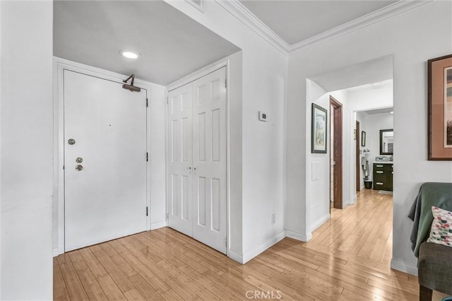 1203 N Sweetzer Ave Unit 215, West Hollywood, CA 90069 - foyer entrance featuring light wood-style floors and ornamental molding