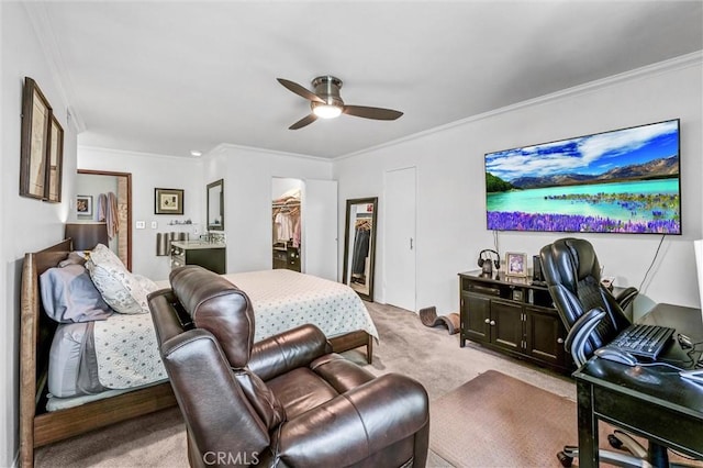 1203 N Sweetzer Ave Unit 215, West Hollywood, CA 90069 - bedroom with light colored carpet, crown molding, a walk in closet, and a ceiling fan