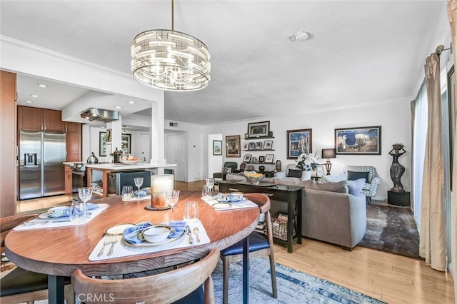 1203 N Sweetzer Ave Unit 215, West Hollywood, CA 90069 - dining space featuring light wood-type flooring, a chandelier, crown molding, and recessed lighting