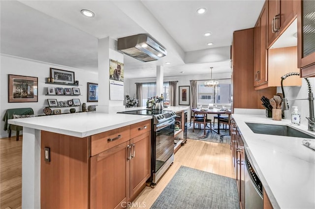 1203 N Sweetzer Ave Unit 215, West Hollywood, CA 90069 - kitchen with appliances with stainless steel finishes, ventilation hood, brown cabinets, light wood-style floors, and light countertops