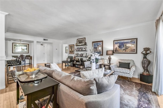 1203 N Sweetzer Ave Unit 215, West Hollywood, CA 90069 - living area with light wood-style floors and crown molding