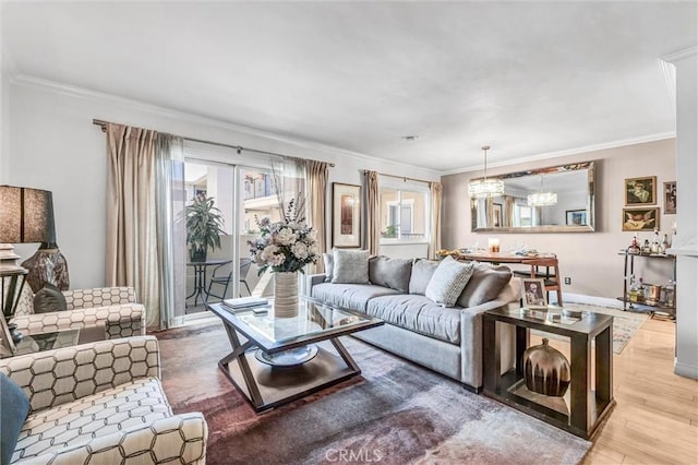 1203 N Sweetzer Ave Unit 215, West Hollywood, CA 90069 - living area featuring ornamental molding, wood finished floors, and a chandelier