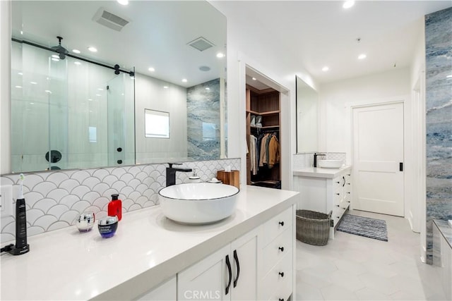 23670 Shirwaun, Apple Valley, CA 92307 - full bathroom featuring decorative backsplash, a shower stall, vanity, recessed lighting, and a spacious closet