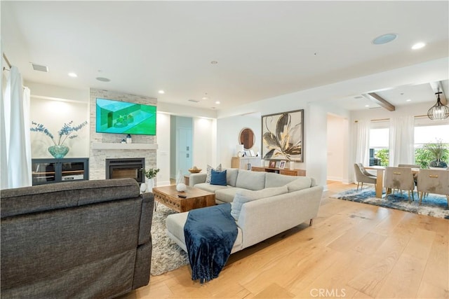 23670 Shirwaun, Apple Valley, CA 92307 - living room featuring light wood finished floors, a large fireplace, recessed lighting, and beam ceiling