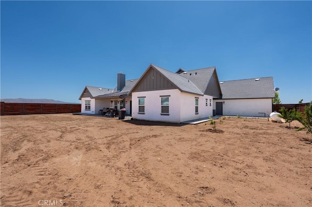 23670 Shirwaun, Apple Valley, CA 92307 - rear view of property featuring a fenced backyard and board and batten siding