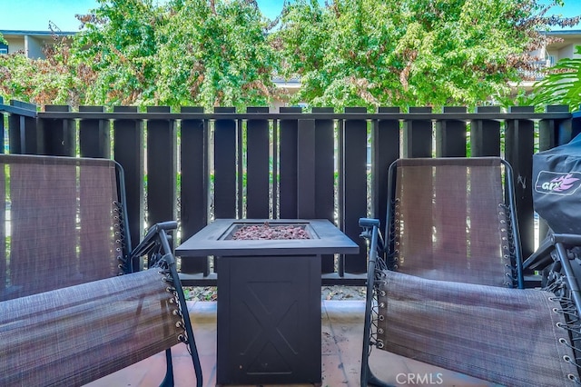 12200 Montecito Rd Unit C103, Seal Beach, CA 90740 - view of patio / terrace featuring a fire pit