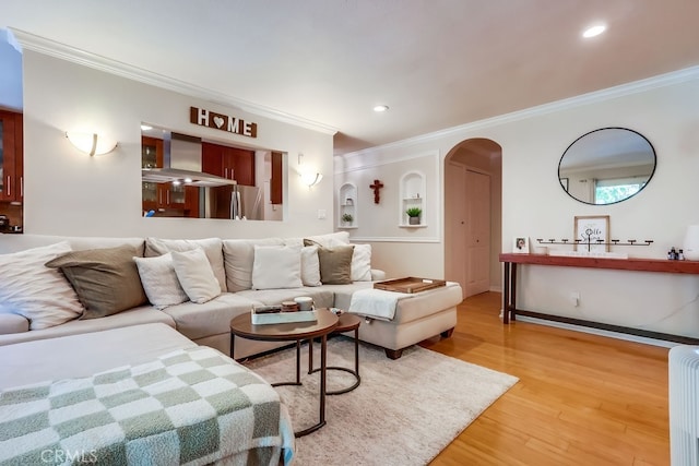 12200 Montecito Rd Unit C103, Seal Beach, CA 90740 - living area with arched walkways, crown molding, radiator heating unit, light wood-style floors, and recessed lighting