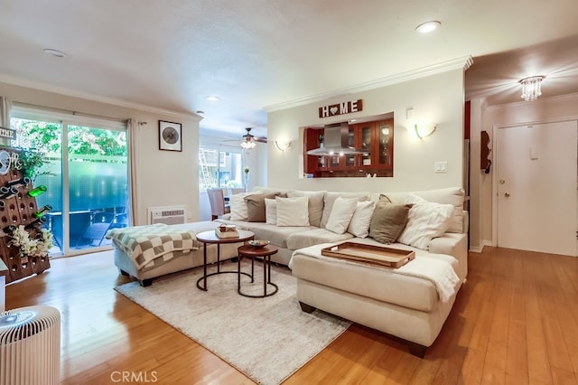 12200 Montecito Rd Unit C103, Seal Beach, CA 90740 - living room with crown molding, wood finished floors, recessed lighting, and a ceiling fan