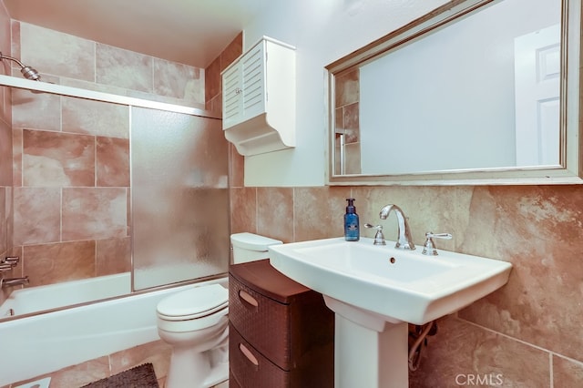 12200 Montecito Rd Unit C103, Seal Beach, CA 90740 - bathroom with shower / bath combination with glass door, tile walls, tile patterned flooring, and decorative backsplash