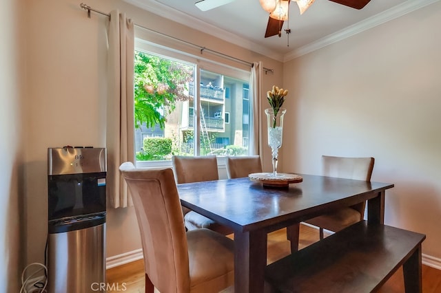12200 Montecito Rd Unit C103, Seal Beach, CA 90740 - dining room featuring a ceiling fan, crown molding, and wood finished floors