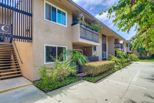 12200 Montecito Rd Unit C103, Seal Beach, CA 90740 - view of property featuring stairway