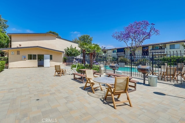 12200 Montecito Rd Unit C103, Seal Beach, CA 90740 - view of patio / terrace with a community pool and area for grilling