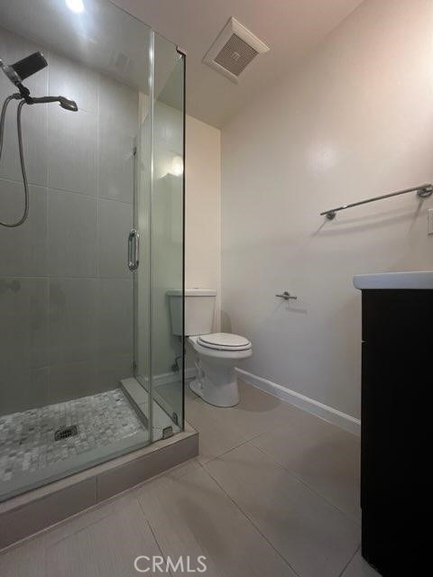 401 W Harvard St, Glendale, CA 91204 - full bathroom featuring a shower stall, vanity, and vaulted ceiling