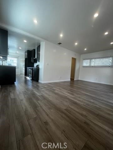 401 W Harvard St, Glendale, CA 91204 - unfurnished living room with dark wood-type flooring, healthy amount of natural light, and recessed lighting