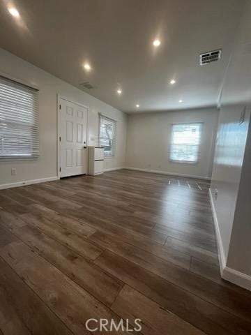 401 W Harvard St, Glendale, CA 91204 - unfurnished living room featuring dark wood-type flooring and recessed lighting