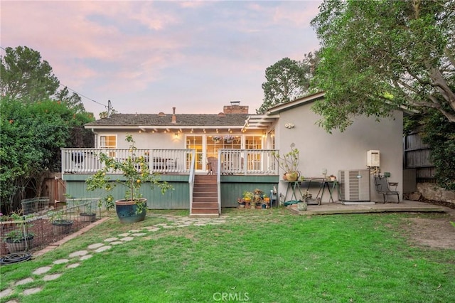 109 Via Ardilla, Palos Verdes Estates, CA 90274 - rear view of house featuring a lawn, a wooden deck, a chimney, stucco siding, and stairway