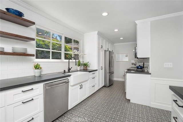 109 Via Ardilla, Palos Verdes Estates, CA 90274 - kitchen with appliances with stainless steel finishes, dark countertops, white cabinetry, decorative backsplash, and recessed lighting