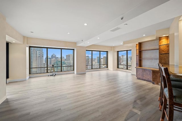 100 Harbor Dr Unit 3004, San Diego, CA 92101 - unfurnished living room with wood finished floors, a view of skyline, and recessed lighting